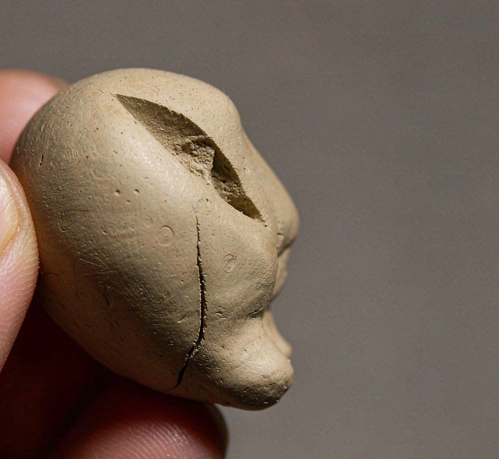 Air Dry Clay Drying Behavior Macro of an air dry clay ball showing surface cracks as it dries
